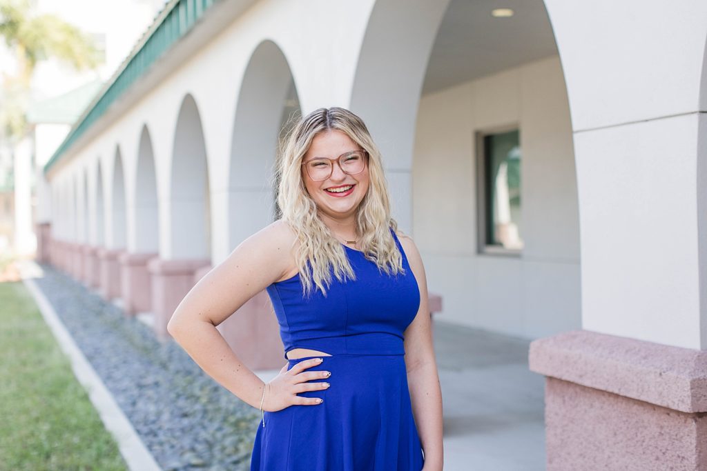 Girl smiling for senior pictures at Florida Gulf Coast.