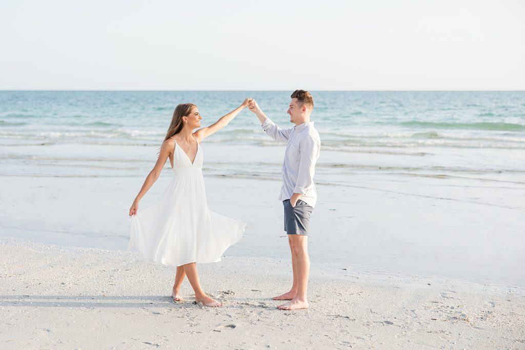 A couple dancing on Lido Key Beach captured by Deanna Grace Photography. 