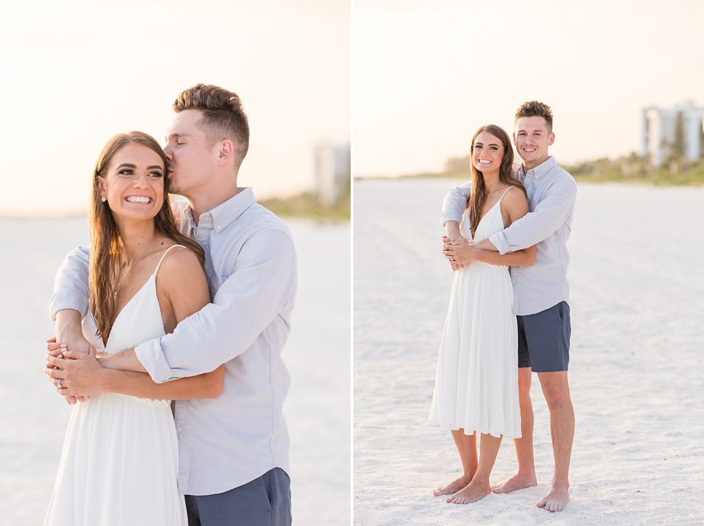 A couple holding each other during their Lido Key Beach engagement session. 