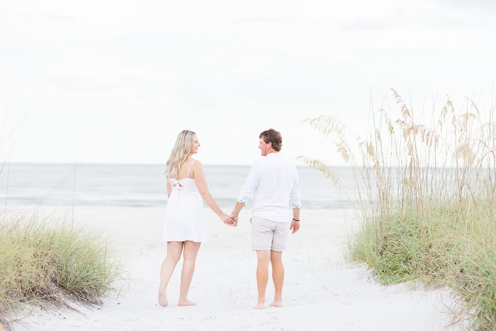 A couple walking on Fort Myers Beach. 