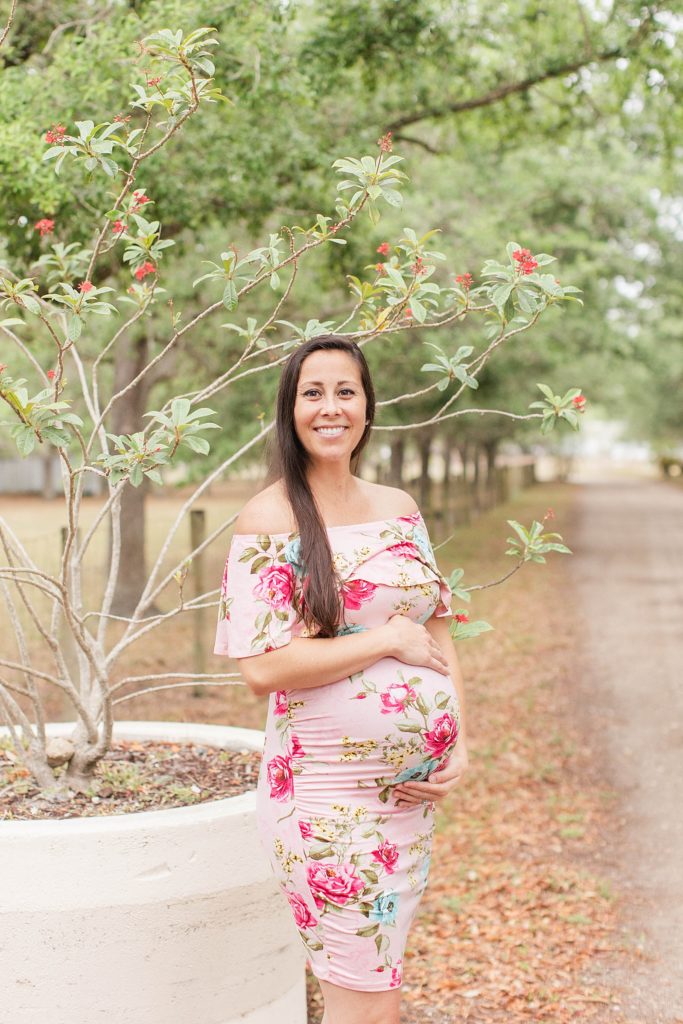 Mother smiling during her maternity session. 