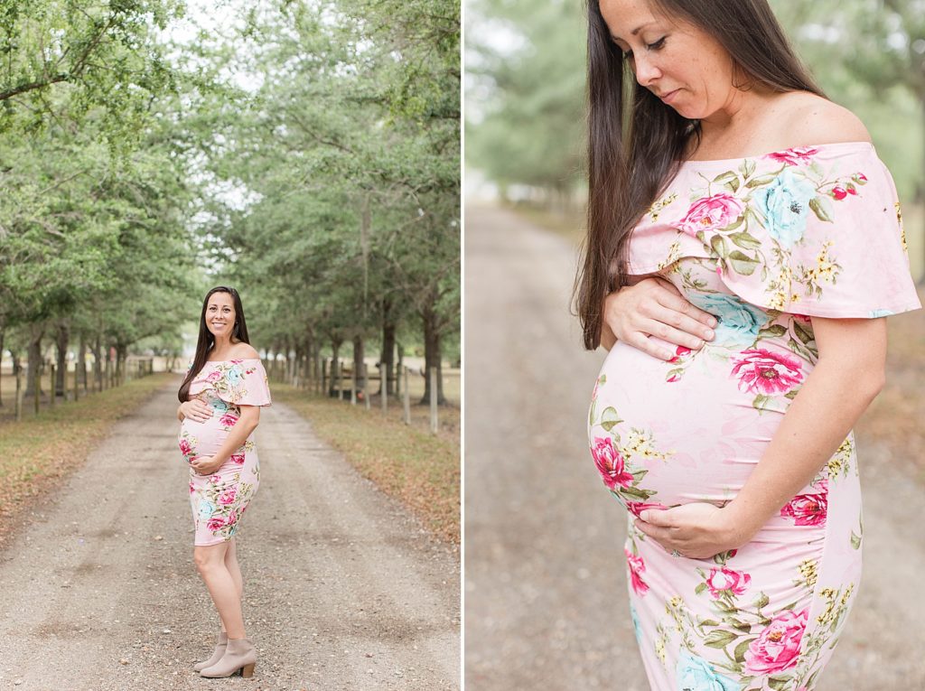 A pregnant mother holding her belly during maternity pictures. 