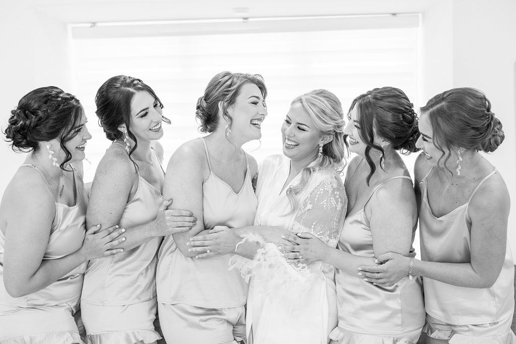 bridesmaids laughing.