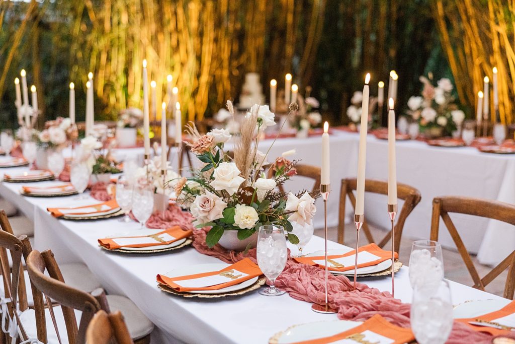 A dessert rose wedding reception table set up. 