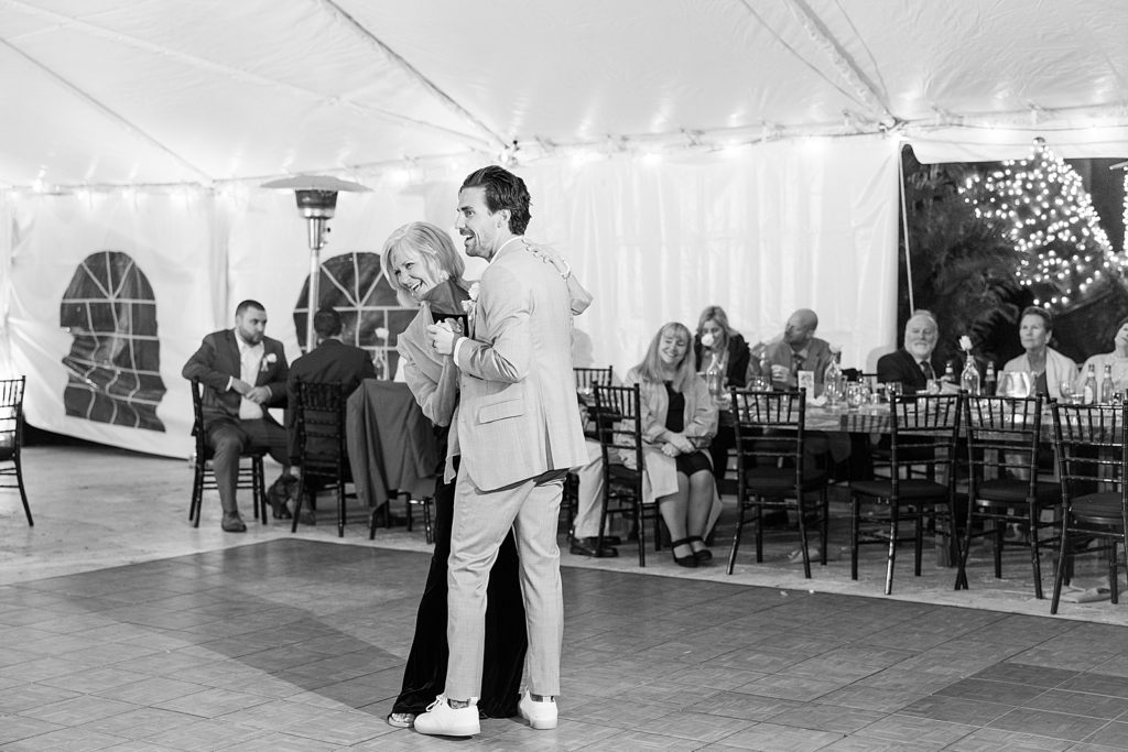 Mother and son dance at his wedding. 