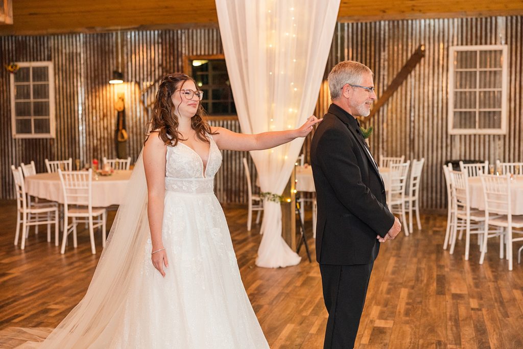 bride first look with dad at the naples wedding barn.