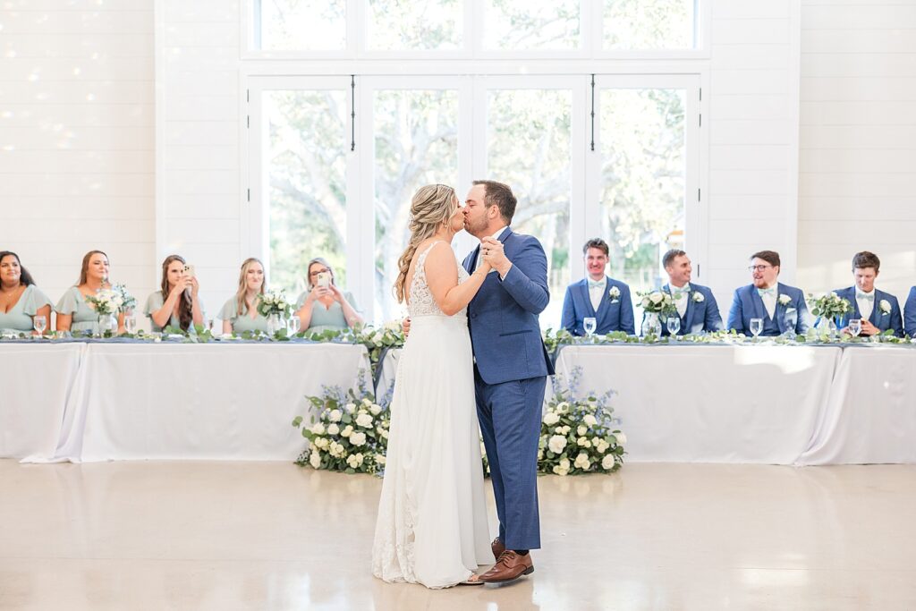 Bride and Groom kissing while dancing. 