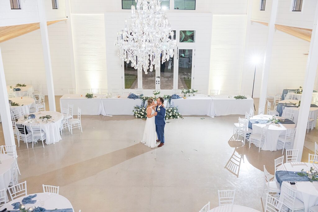 Bride and Groom dancing alone in the reception hall at Kings Crossing Barn. 