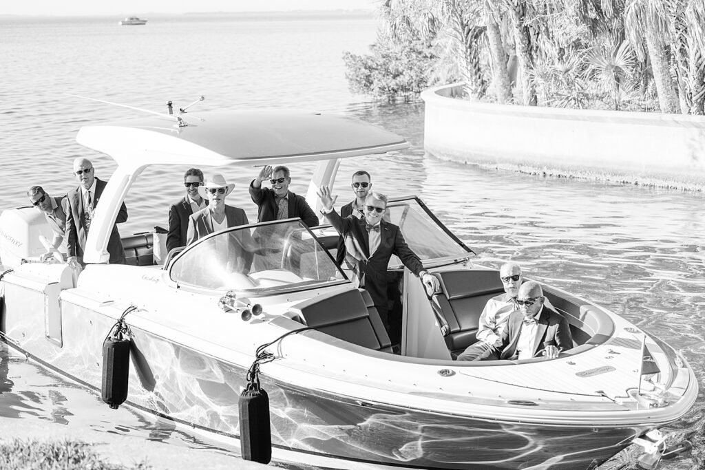 Groom arriving by boat at the Seagate Powel Crosley Estate. 