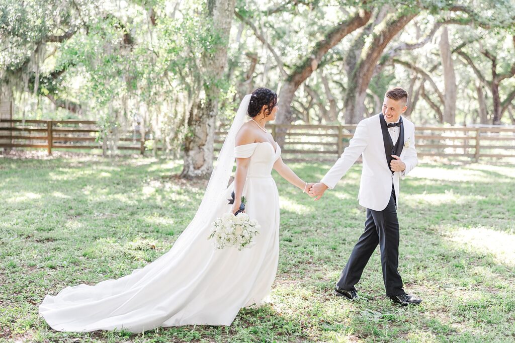 Bride and Groom walking at Wandering Oaks in Myakka City, Florida. 