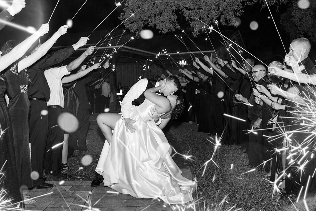 Black and white photo of a sparkler exit. 