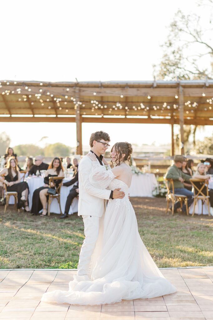 Bride and groom dancing at their outdoor reception. 