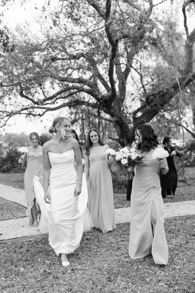 Bride walking with her bridesmaids