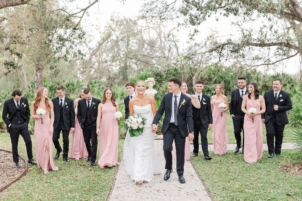 The bridal party wearing pink and black at Hudson Manor at Diamond C Ranch.