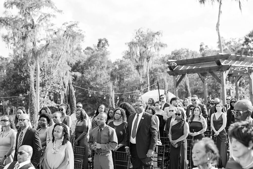 black and white photo of the guests standing. 